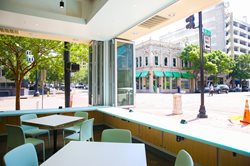 Image of the Interior of the Bread & Board Restaurant Looking out at Laura Street