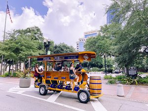 Photo of people enjoying the Pedal Pub cruise in Downtown Jax