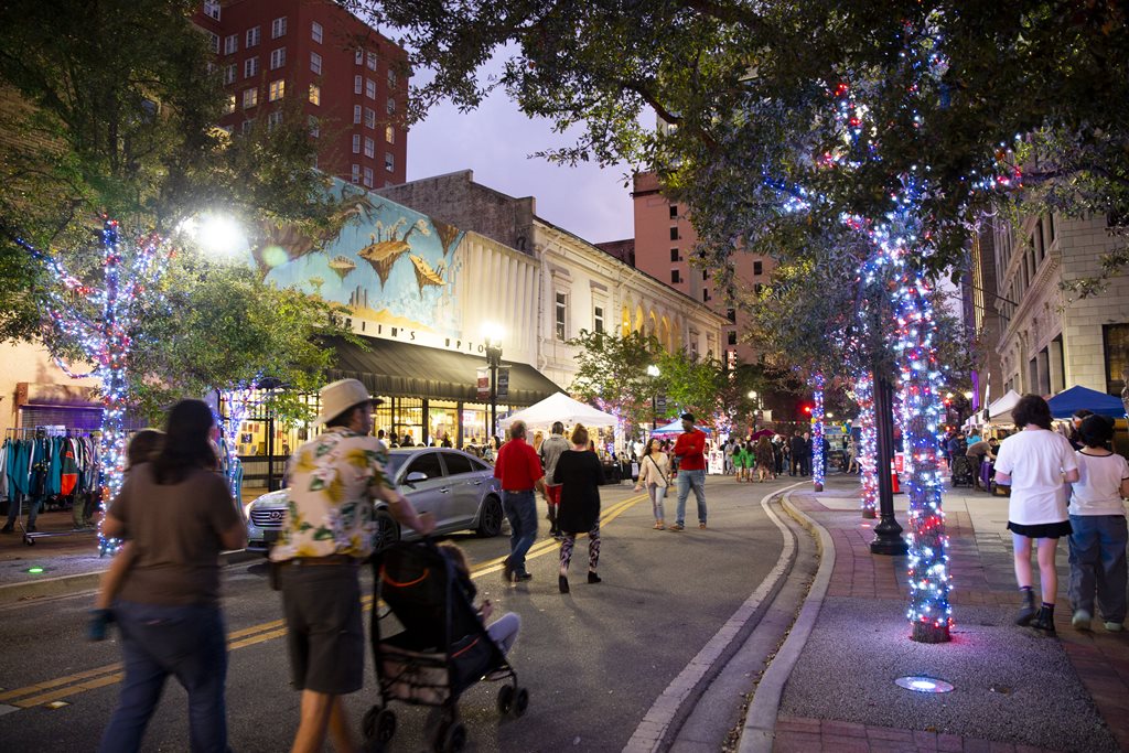 Image of Lights on Laura Street with People Walking Around Enjoying the Downtown Retail
