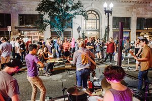 Photo of a band playing music in Downtown street during Art Walk